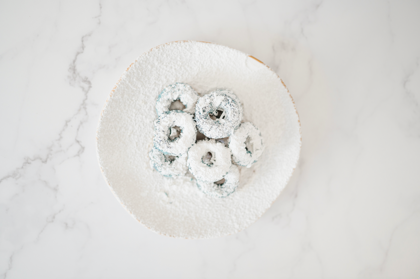 miss mini donuts on our Marble Board Backdrop for food and product photography. Also available on our smooth vinyl backdrops!